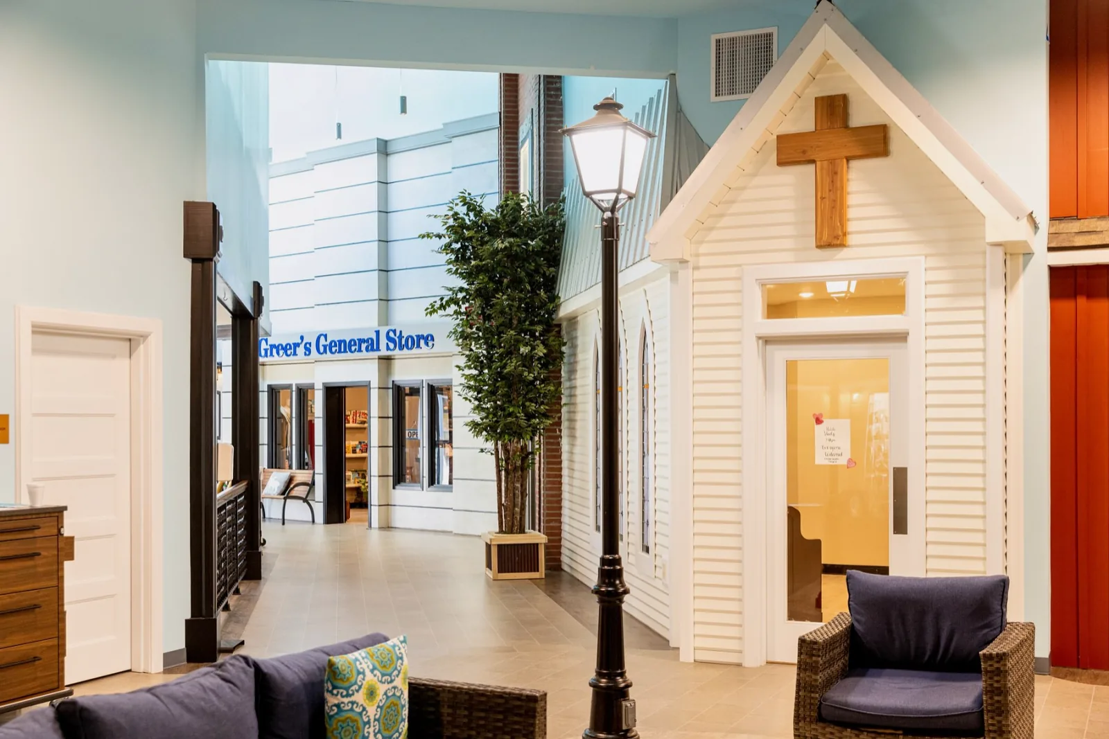 The chapel, a lamp post and Greer's General Store on the indoor Main Street in memory care.